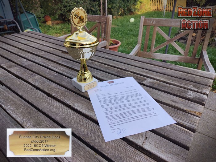 picture of a trophy and a letter